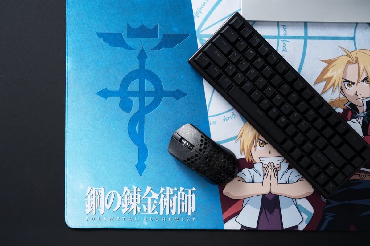 Ed & Al XL cloth mousepad on a desk with a keyboard and gaming mouse