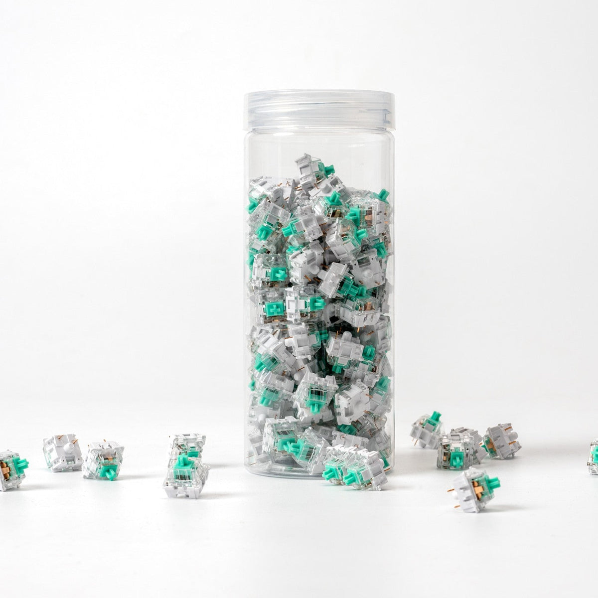 Keychron K Pro Mint switches in their bottle, with loose switches