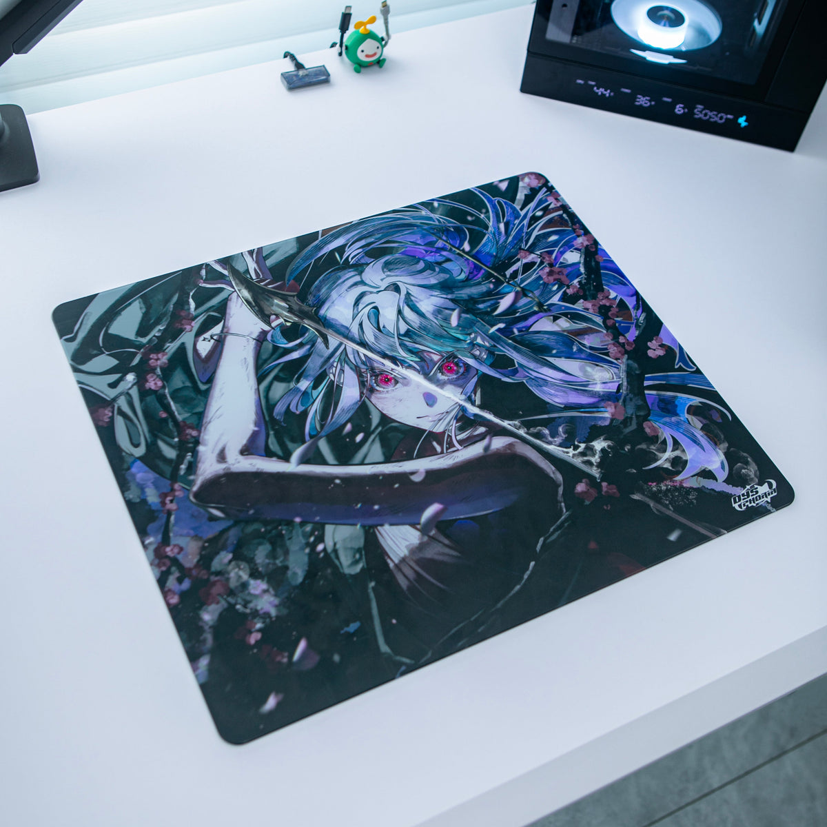 Dysphoria SAYO glass mousepad on a white desk