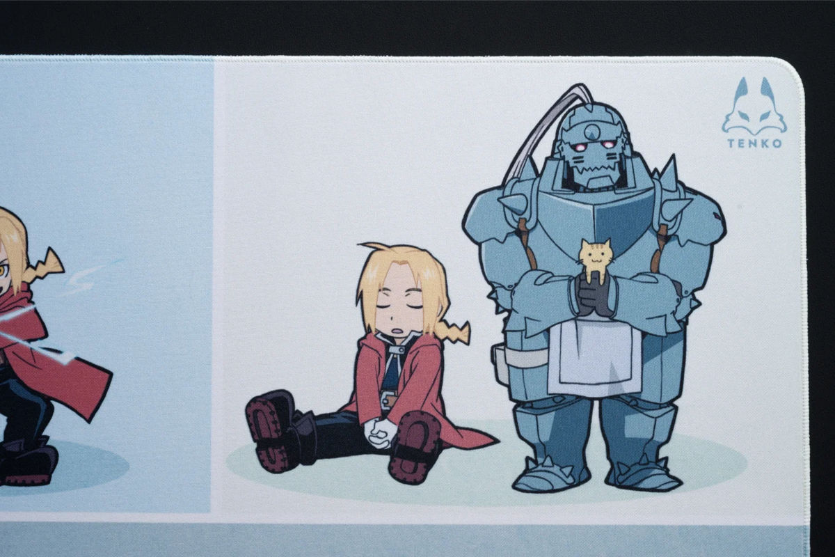 Close-up of chibi Ed and Al and the stitched corner of the Chibi Alchemists cloth mousepad