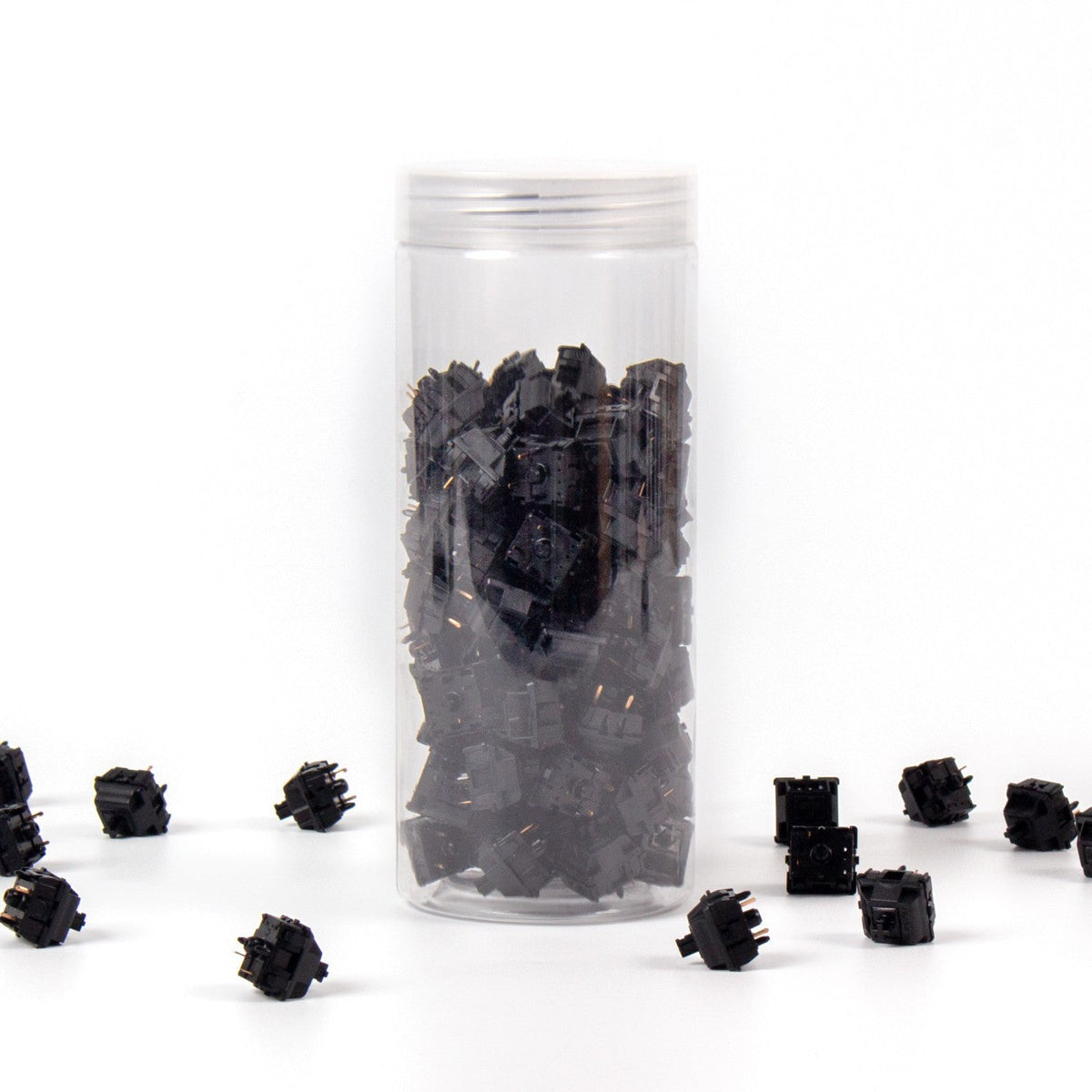 Gateron Oil King linear switches in their bottle, with loose black switches