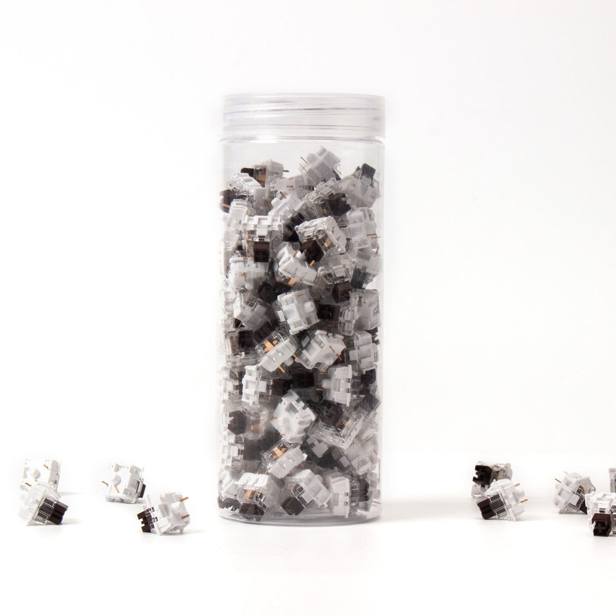 Keychron K Pro Brown switches in their bottle, with loose switches