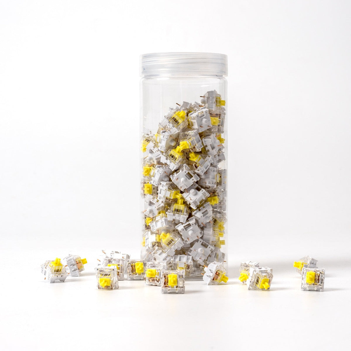 Keychron K Pro Banana switches in their bottle, with loose switches