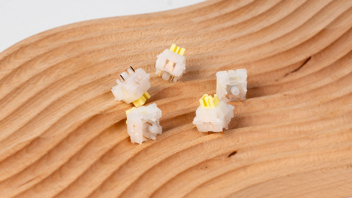 Keychron Silent Banana switches on a wooden surface