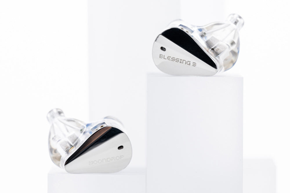 MOONDROP Blessing 3 earpieces on white stands